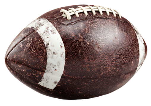 A vintage worn leather american football isolated on a black background