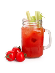Mason jar of bloody mary with celery and tomatoes on white background