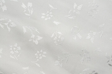 Elegant white floral fabric with subtle embossed flower pattern