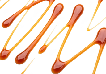 Abstract pattern of flowing caramel sauce drips and swirls isolated on transparent background