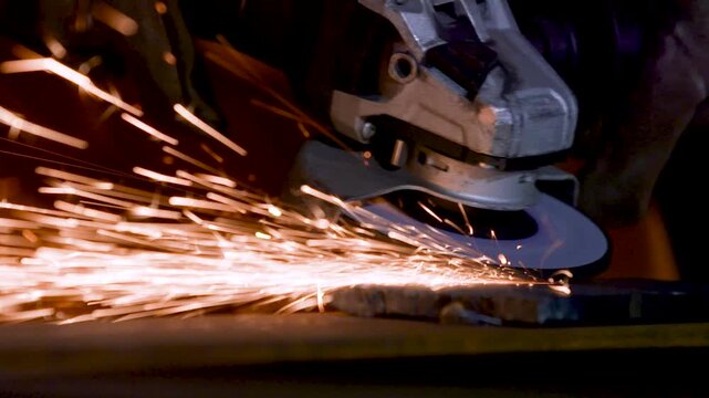 Industrial Welding Worker with Dynamic Sparks During Manufacturing