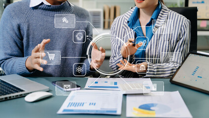 Working team meeting concept, business using laptop and smart phone and digital tablet computer with digital marketing media in virtual icon network diagram office