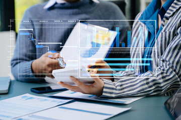 Businessman hand Project manager working and update tasks and Gantt chart scheduling virtual diagram