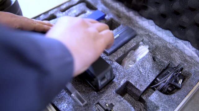 Hands Holding Blue Textured Case with Label Sticker Close-up