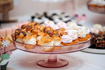 Candy bar of different cookies, candy and sweets at party