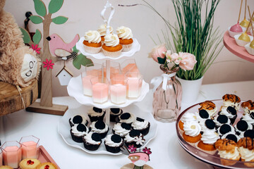 Candy bar of different cookies, candy and sweets at party