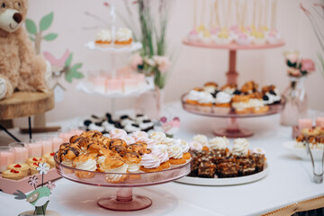 Candy bar of different cookies, candy and sweets at party