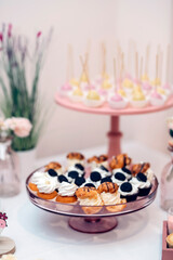 Candy bar of different cookies, candy and sweets at party
