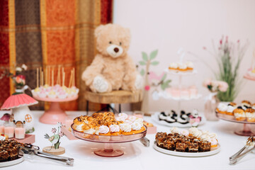 Candy bar of different cookies, candy and sweets at party
