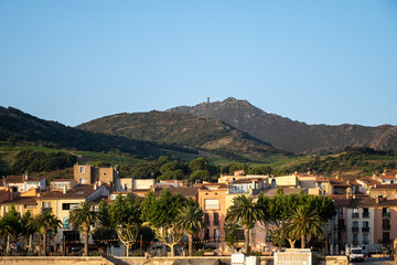Obraz premium View of colourful Collioure, narrow streets and yellow, pink, orange houses, summer vacation destination town with historical buidings and beaches, Pyrenees-Orientales, France