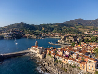 Aerial view of colourful Collioure, narrow streets and yellow, pink, orange houses, summer vacation...