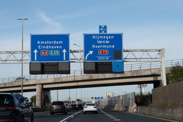 Road transportation in the Netherlands, Dutch highways, road signes, directions, driving car on multi line road, traffic jam in rush hours
