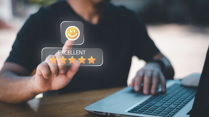 Businessman using smartphone to give five-star positive review with smiley face icon, Customers give 5-star reviews,symbolizing excellent customer feedback, and user satisfaction in digital service.