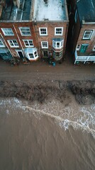Rising Tide of Disaster: Flooded Residential Area with Water Flowing Between Houses