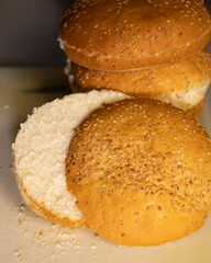 Slicing burger bun close up on kitchen counter