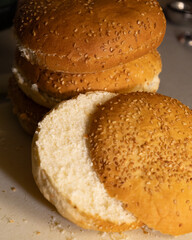 Slicing burger bun close up on kitchen counter