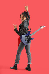 Fototapeta premium Happy young African-American woman in leather jacket with electric guitar showing 