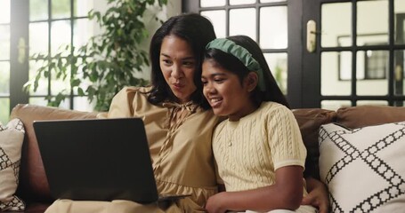Laptop, smile and relax with mother and daughter on sofa for streaming service, movie choice and education show. Film subscription, bonding and online kids series with woman and child in family home - Powered by Adobe