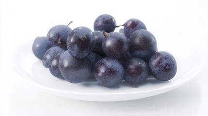 Fototapeta premium Fresh dark juneberries on white plate isolated. Generative AI