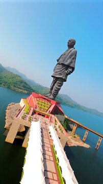Aerial view of the Statue of Unity, Kevadia, rising majestically beside the Narmada River in Gujarat, India. Stunning panoramic landscape featuring the world&rsquo;s tallest statue surrounded by lush greene