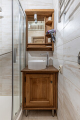 Compact Bathroom Interior with Wooden Cabinet and Modern Sink