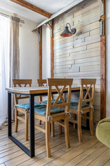Wooden Dining Area with Soft Cushioned Chairs