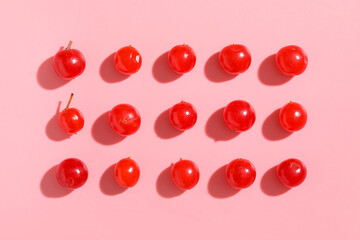 Composition with fresh viburnum berries on pink background, closeup