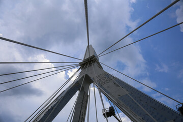 Cable-Stayed Bridge Pylon Viewed from Below Against Blue Sky