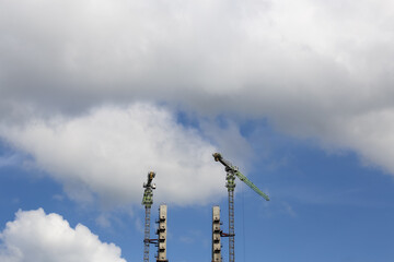 Construction of High-Rise Structural Framework of Cable Stayed Tower Bridge with Tower Cranes