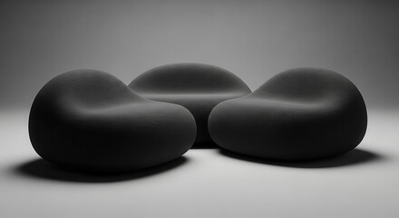 Modern boneless couch design featuring three smooth, rounded seating elements in a minimalist setting, showcasing contemporary furniture aesthetics and innovative style
