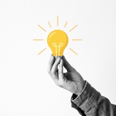 Inspiring creative idea with a bright yellow lightbulb held in hand