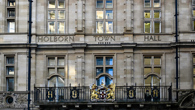 LONDON, UK - NOVEMBER 18, 2025:  Front facade of Holborn Town Hall in High Holborn with sign