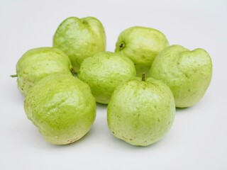 Several kimju guava are placed on a white background. They are healthy fruits and I grow them organiclly.