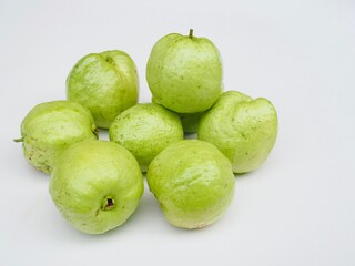 Several kimju guava are placed on a white background. They are healthy fruits and I grow them organiclly.