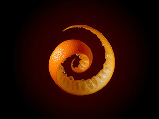 A vibrant, bright orange peel spirals gracefully in a dynamic, curved motion, appearing isolated and floating on dark background