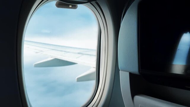 An airplane wing as seen from the cabin.
Air transport and passenger transportation.
An airplane flies above the clouds.
A large passenger plane gains altitude and flies during the day.