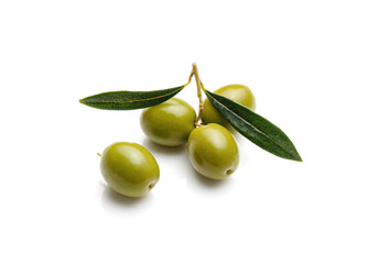 green olives with green leaves isolated on white background.