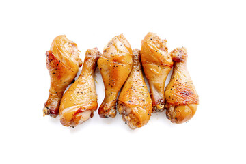 Grilled chicken legs on white background.