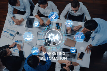 Dynamic business meeting showcasing a team collaborating on marketing automation strategies using technology tools in a modern office setting. Trope