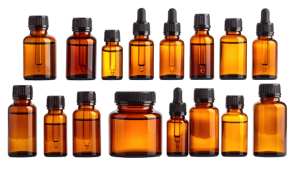 Assortment of amber glass bottles with droppers, on black background