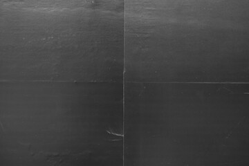 Black poster paper texture divided into 4 parts with lines
