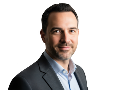 A professional headshot of a man with short dark hair and a beard wearing a dark suit, blue, business suit, businessman, man, portrait, pose, smile, stand, stare, suit, tie, wear 