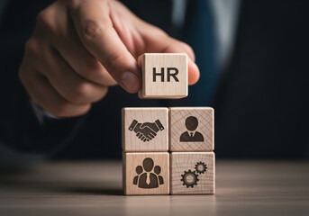 Focused man building smart hr hiring system with wooden block for business management and recruitment strategy concept