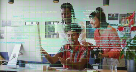 Seated tech dev clicking and typing, starting code overlay while team reviewing monitor design