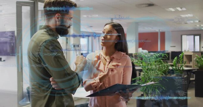 Pair reading folder in biz, woman pointing sparking blue waves rising then fading, clarifying data