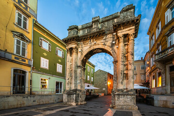 The Arch of the Sergii, Ancient Roman triumphal arch located in Pula, Istria, Croatia in morning...