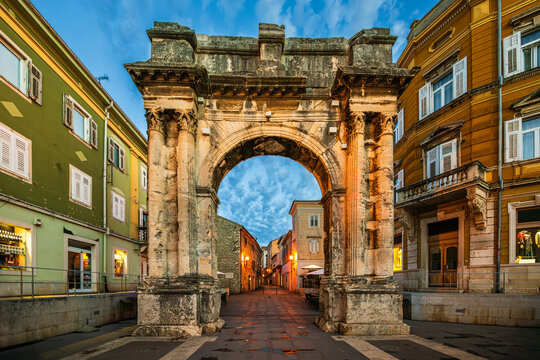 The Arch of the Sergii, Ancient Roman triumphal arch located in Pula, Istria, Croatia in morning dawn. 