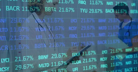 Female clinician tapping tablet in clinic corridor, animated ticker fading to reveal patient data