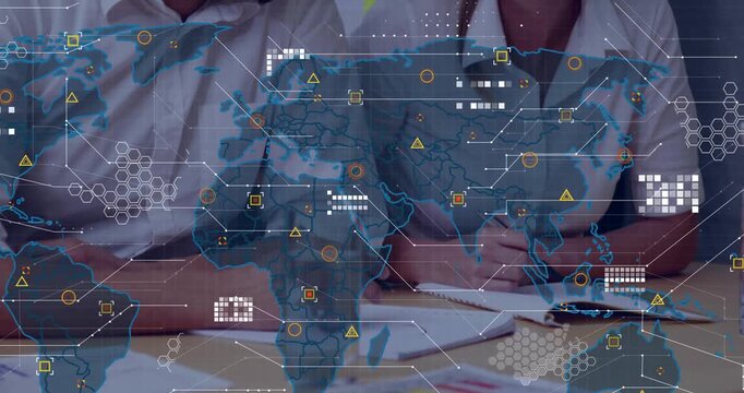 Two business colleagues reviewing bar chart, noting and initiating world map overlay over desk