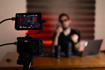 Blogger is recording a video for their blog with camera